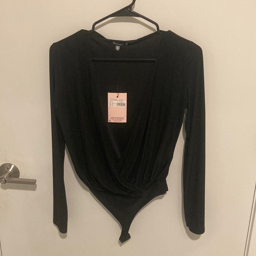 Never worn, black long sleeve bodysuit